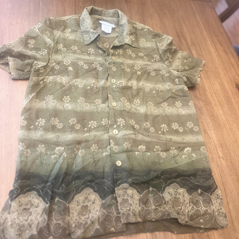 Sheer blouse with floral pattern.